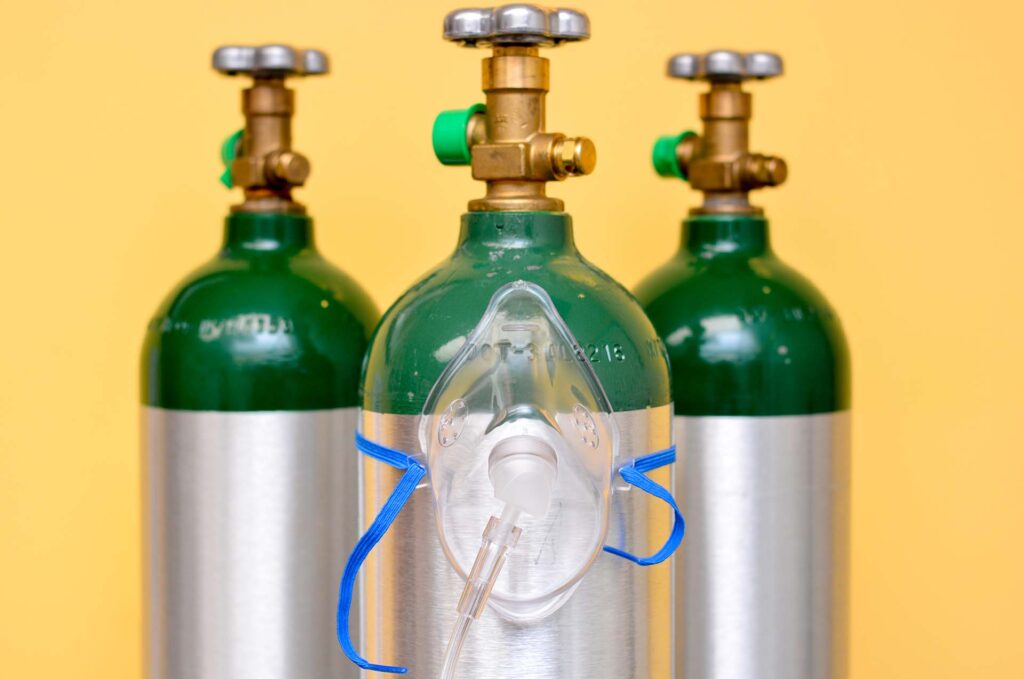 What specific features make medical oxygen cylinders essential in emergency medical services?
